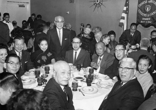 In celebration of Delbert Wong's elevation to the Superior Court of California, the Chinese American Citizens Alliance gave a dinner. This is a photograph of the leaders of the Chinatown community in attendance which included: Mr. and Mrs. Poy Wong, Counsel General and Mrs. Mong Ping Lee, Earl Wong, father of Judge Wong, Billie Lew, Yip Ying, Mr. and Mrs. Lui Hong, Gee Gay Wot, and Woo Kit Man