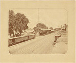[View overlooking freight sheds and station of Sacramento Valley Railroad along Sacramento River]