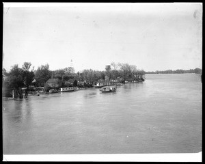 Houseboat traveling down the Sacramento River, ca.1900