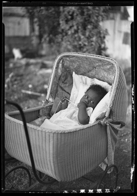 Baby in wicker carriage