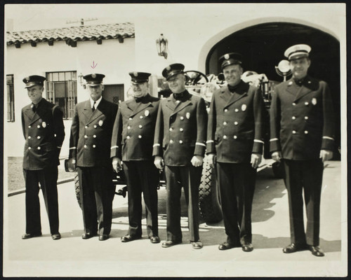 Edwin D. Wilhite (2nd from left) and five unidentified personnel in front of Station No. 12, 6509 Gundry