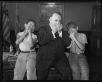 Los Angeles Mayor Frank Shaw and two young harmonica players, Los Angeles, 1935