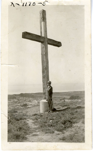 Woman Next to Hill Cross