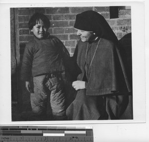 Maryknoll Sister with a child at Dalian, China