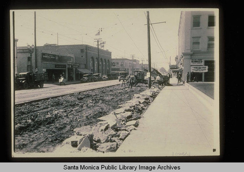Santa Monica Blvd. at Fourth Street looking southwest past Santa Monica Sporting Goods, Western Union and California Bank