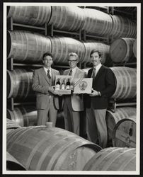 Sam Sebastiani, William Hill, and Michael Mondavi displaying the 1985 Presidential Wine Selection