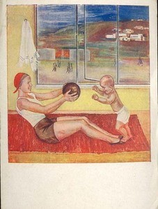 Woman holding a ball and playing with a child