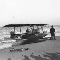 A bi-plane on a beach