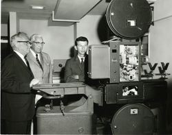 Warren Sherlock, Edward Foley and RCA president viewing equipment