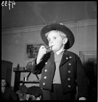 [Miscellaneous Numbered Negatives: young boy in traditioanl Alsatian(?) suit.]