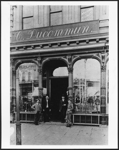 Exterior view of the C. Ducommon Company hardware store, located at Spring Street and Temple Street, ca.1880-1940
