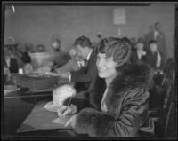 Aimee Semple McPherson gives a handwriting sample, Los Angeles, 1926