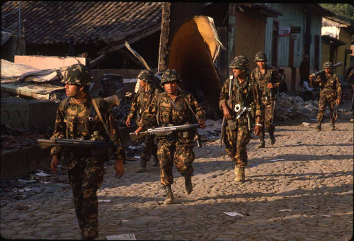 Soldiers moving through the town, San Agustín, Usulután, 1983