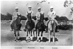 Polo players on horseback