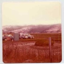 Photographs of landscape of Bolinas Bay. Two pickup trucks at dig site