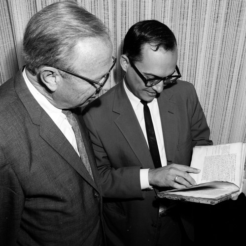 Melvin Voight and Ronald Silveira with rare book