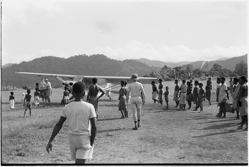 Wanuma: airplane and crowd of people on mission's landing strip