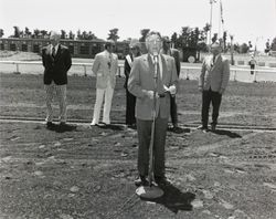 Members of the board and others standing on the race track at the Sonoma County Fairgrounds, 1972
