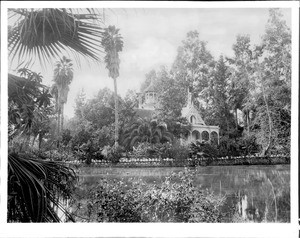 Elias Jackson "Lucky" Baldwin's Rancho Santa Anita Queen Anne Cottage (the club house), viewed across the lake in Arcadia, Los Angeles, ca.1900