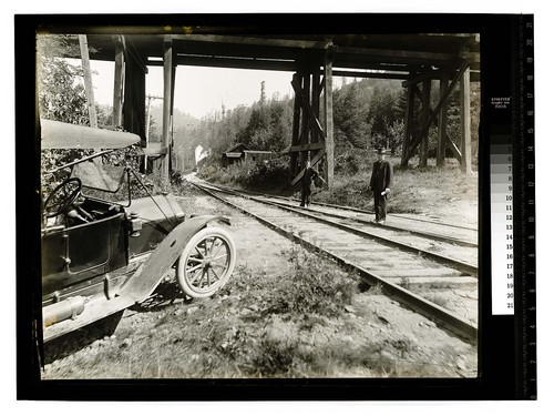 [Train approaching trestle and where two men are standing]