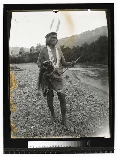 [Indian leader, standing on river bank]