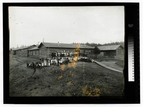 Humboldt State Normal (Temporary Buildings) [Large group posing in front of full view of the buildings]