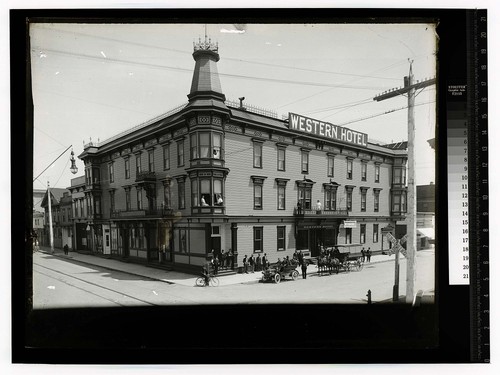 Scene in the City ofEureka [Western Hotel with auto and horse drawn vehicles in front]