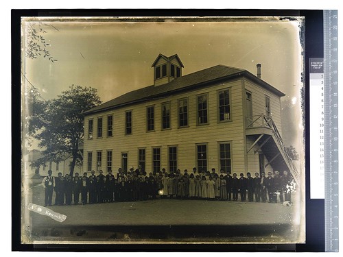 [Children and teachers pose in front of building on Hoopa Valley Reservation]