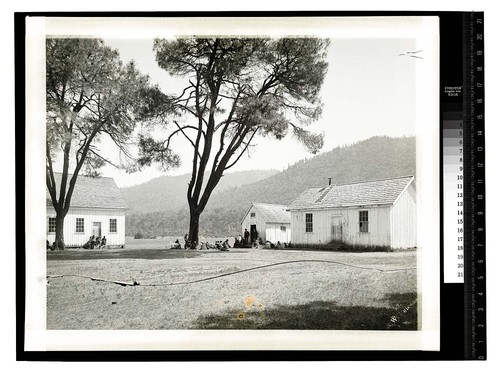 Scene at Fort Gaston, Humboldt Co. [Groups sitting near Fort Gaston buildings]