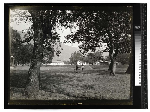 [Two young mena and a bicycle at Hoopa Valley Reservation]