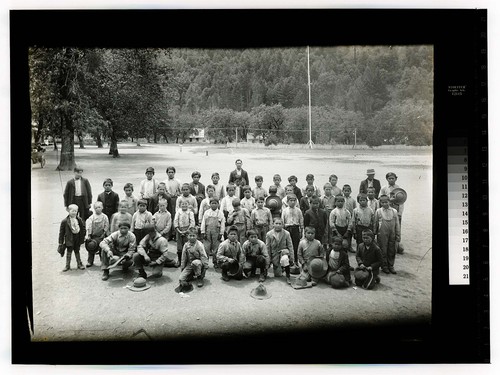 [Large group of boys and a few adults posing at the Hoopa Valley Reservation]