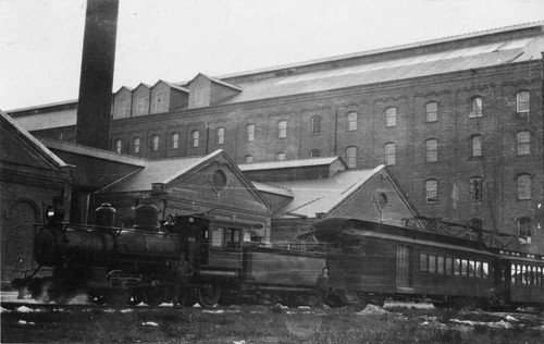 [Spreckels Sugar Company factory with train alongside]