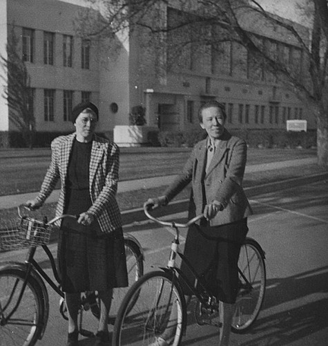 [Katherine Esau and colleague on bicycles]