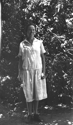 [Katherine Esau standing by large shrub in Davis, California]