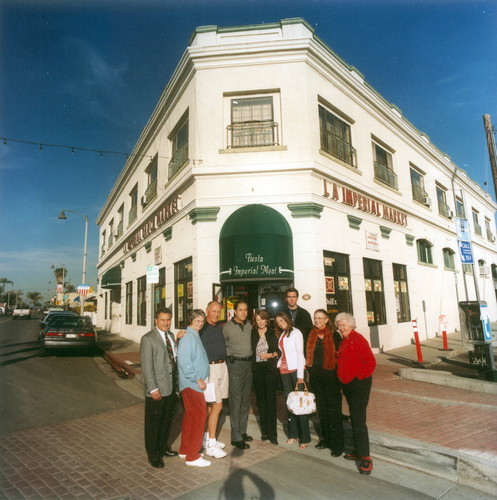Photograph of members of the Placentia Historical Committee standing in front of the Kraemer Building