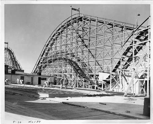 Construction of Pacific Ocean Park underway in front of the Sea Serpent roller coaster (earlier known as the Hi-Boy), November, 1957, Santa Monica, Calif