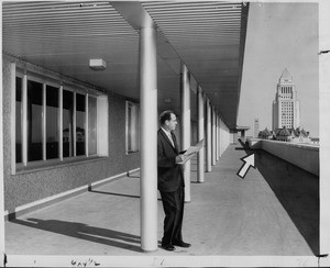 Supervisor Kenneth Hahn standing on one of the Los Angeles County Hall of Administration's terraces, 1960