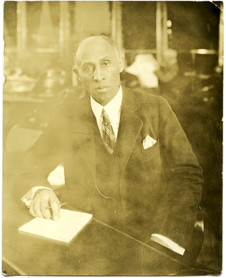 Portrait of Frederick M. Roberts seated at desk