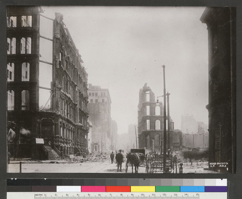 [View of ruins and rubble along Montgomery St. Looking south from California St.]