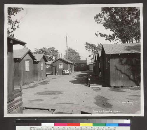 Camp 24, Columbia Square. [Refugee children among cottages.]