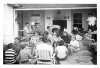 Group of students seated on outdoor patio