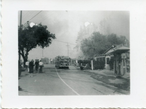 Fire trucks assembled during a wildfire in Malibu, 1956