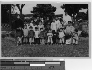 A Maryknoll Sister with children from the orphanage at Luoding, China, 1936