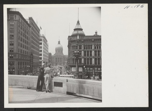 Looking down Market Street from the War Monument is the Capitol Building in downtown Indianapolis. Photographer: Mace, Charles E. Indianapolis, Indiana