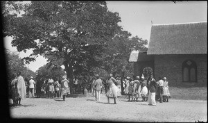 African people gathering at the entrance of a church