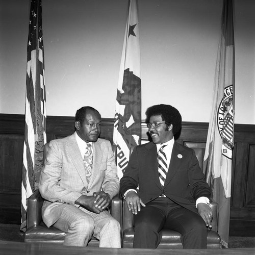 Tom Bradley sitting with John Floyd, Los Angeles, 1982