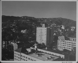 A high-angle view of the Hollywood Hills apartments as they are surrouded by the mountains