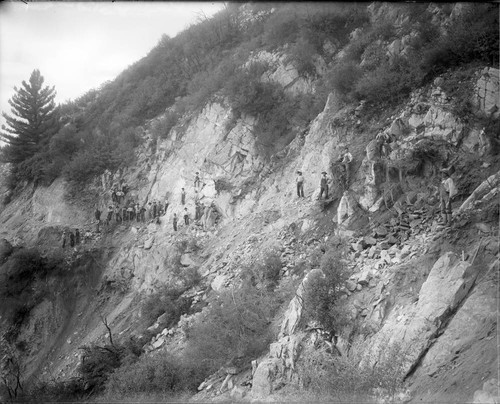 Construction workers widening the toll road below the Pasadena Gap in the San Gabriel Mountains