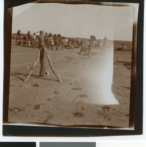 People at the fence of the camp near Mafikeng, South Africa, ca.1901-1903