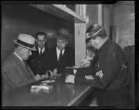 Murder suspect Samuel Whittaker being booked at Central Jail, Los Angeles, 1936